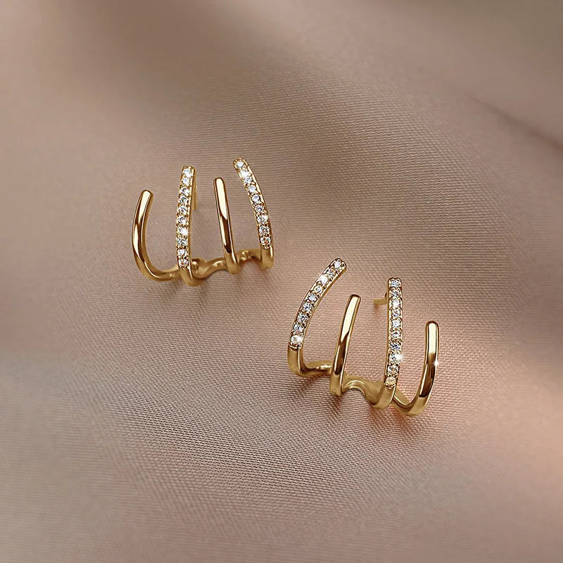 Orecchini attorcigliati — Silhouette elegante in oro o argento