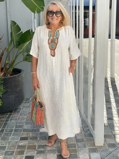 Robe été en lin brodé fendue