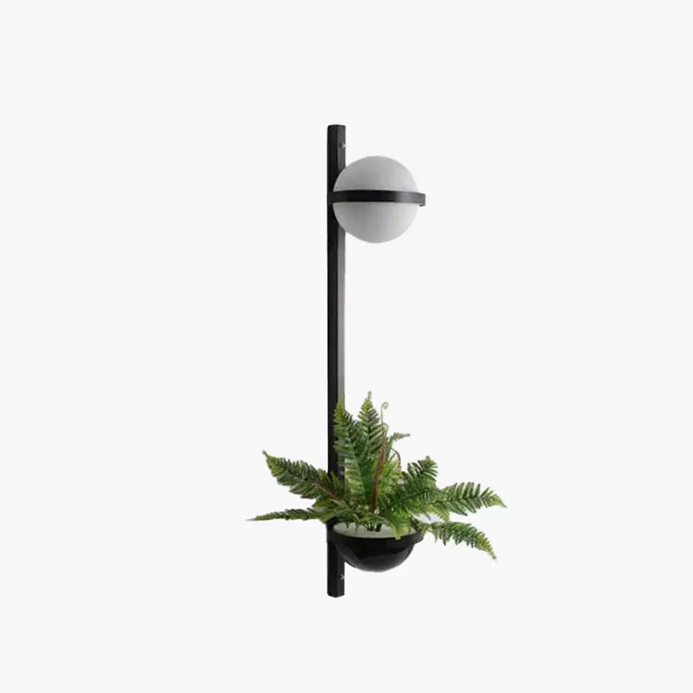 Moderne zwarte wandlamp met groene planten | boxzora