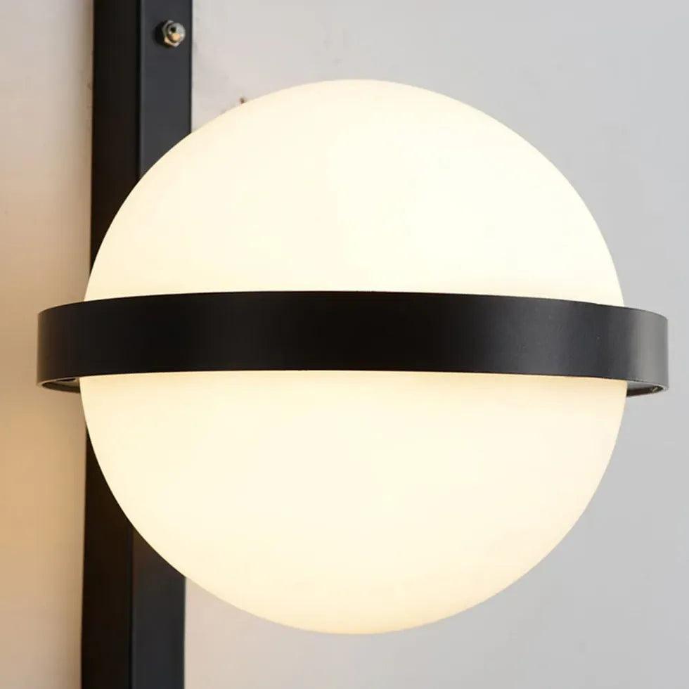 Nowoczesna czarna lampa ścienna z zielonymi roślinami | boxzora
